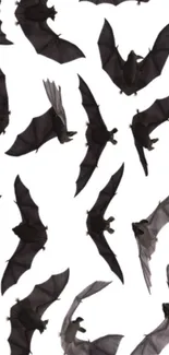 Silhouettes of flying bats on a white background, creating a dark theme.