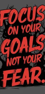 Motivational wallpaper with red text: Focus on your goals, not your fear.