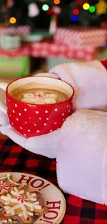 Red mug of cocoa with cookies in Christmas setting.