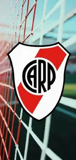 Football club emblem with net background on mobile wallpaper.