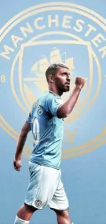 Football player celebrates in front of Manchester City emblem on sky blue background.