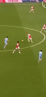 Aerial view of a football match in progress on a green field.