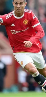 Football player in red jersey running on field