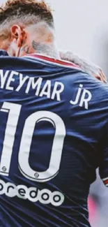 Football player in navy jersey with number 10 displayed.