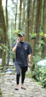 Man walking on stone path in lush forest