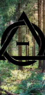 Geometric black symbol over serene forest background wallpaper.