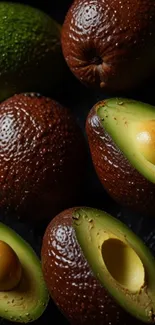 A selection of fresh, ripe avocados in various shades and textures.