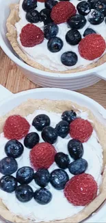 Mobile wallpaper featuring a fresh berry tart with raspberries and blueberries.