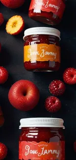 Jars of jam surrounded by fresh fruits on a dark background.