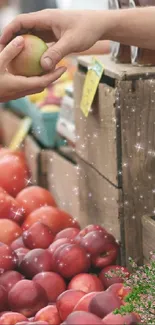 Hands exchanging fruit at a vibrant market stand.