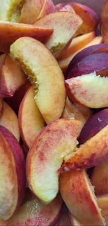 Vibrant slices of fresh peaches piled in a bowl.