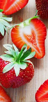 Vibrant strawberries on a wooden background, perfect for a fresh phone wallpaper.