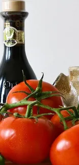 Fresh tomatoes and premium olive oil bottle on a kitchen surface.