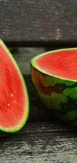 Sliced watermelon on rustic wooden surface.