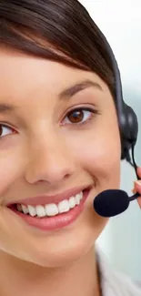 Smiling customer support operator with headset.