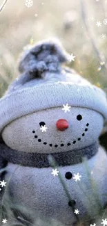 Cute snowman amid frosted grass, serene winter morning scene.