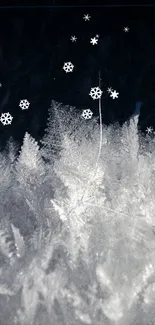 Mobile wallpaper of snowflakes falling over a frosty landscape.