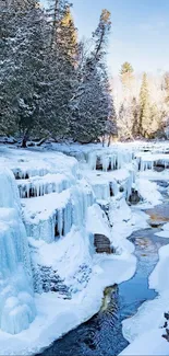 Frozen waterfall amid snowy forest landscape.
