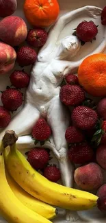 Mobile wallpaper with fruits and a white sculpture.