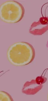 Pink wallpaper with citrus, cherries, and lip prints.