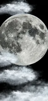 Full moon surrounded by clouds in the night sky wallpaper.