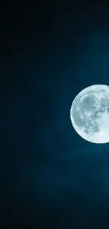 Full moon against a deep blue night sky wallpaper.