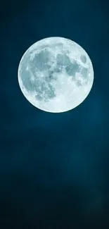 Full moon illuminating a dark blue night sky, creating a moody atmosphere.