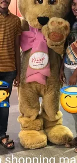 Bear mascot with friends in a mall.