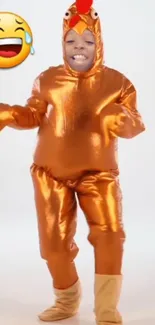 Person in orange chicken costume with laughing emoji.