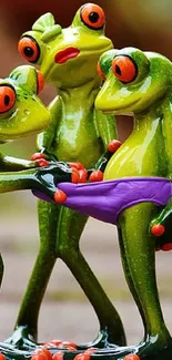 Three playful frog figurines in a humorous pose.