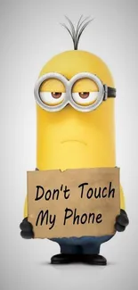 Funny Minion holding 'Don't Touch My Phone' sign on a mobile wallpaper.