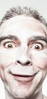 Humorous wallpaper of a man with powdered face expression.