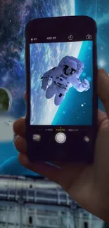 Mobile wallpaper showing an astronaut in space viewed through a phone screen.