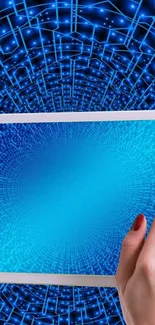 Hand holding tablet with futuristic blue digital patterns.