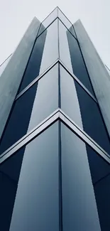 Futuristic steel blue building wallpaper with geometric symmetry.