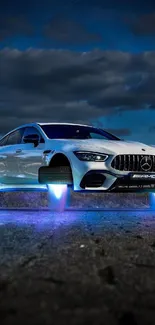 A sleek white car hovering with blue lights on a cloudy night backdrop.