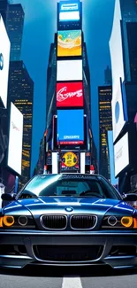 Futuristic car against vibrant Times Square backdrop.