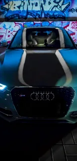 Futuristic car with blue headlights in graffiti tunnel.