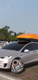 Futuristic silver car with high-tech wheels on a road.