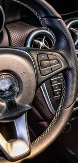 Futuristic steering wheel with alien bust design in car interior.