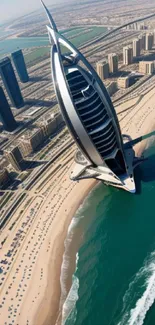 Aerial view of a modern city with a prominent tower by the ocean.