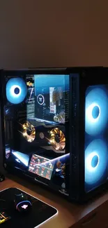 Futuristic gaming setup with glowing blue PC fans and vibrant keyboard.