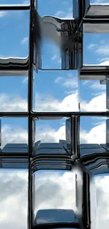 Futuristic glass cubes reflecting a blue sky.