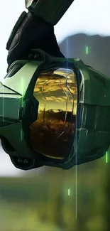 Futuristic helmet with reflective visor showing a scenic landscape.