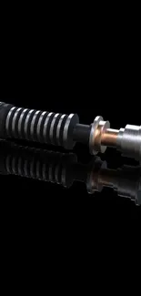 Futuristic metal lightsaber with black background.