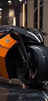 Futuristic orange and black motorcycle design against a sleek backdrop.