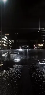 An urban night scene with city lights reflecting on wet streets.