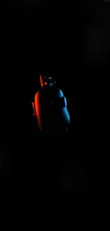 Futuristic robot glowing in dark with blue and orange lights.