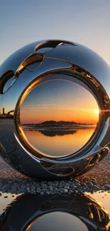 Futuristic metallic sphere reflecting sunset over lake.