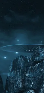 UFO hovering over mountains with starry sky.